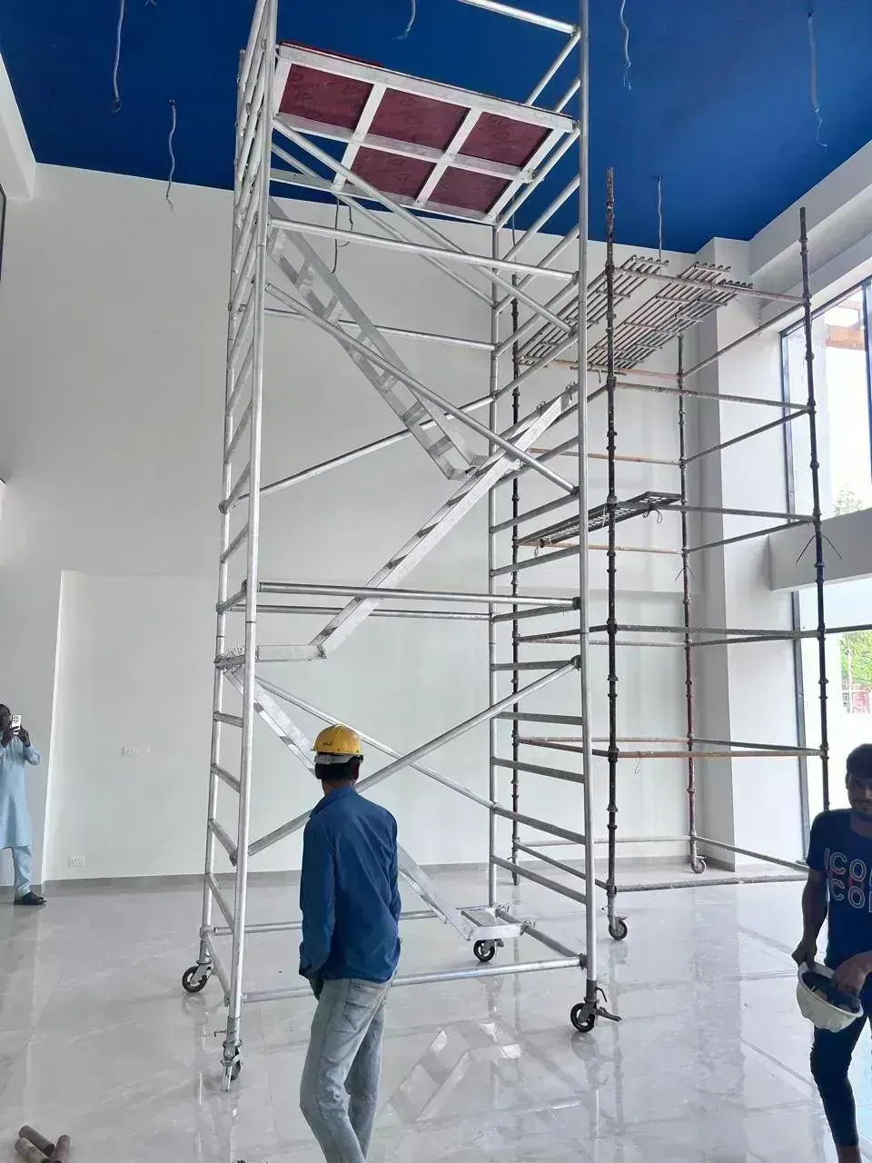 Double width aluminium mobile scaffolding tower rental Bangalore on polished floor